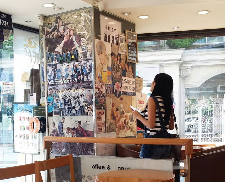 Karen Meets World while looking at JYP artists posters inside Dunkin Donuts